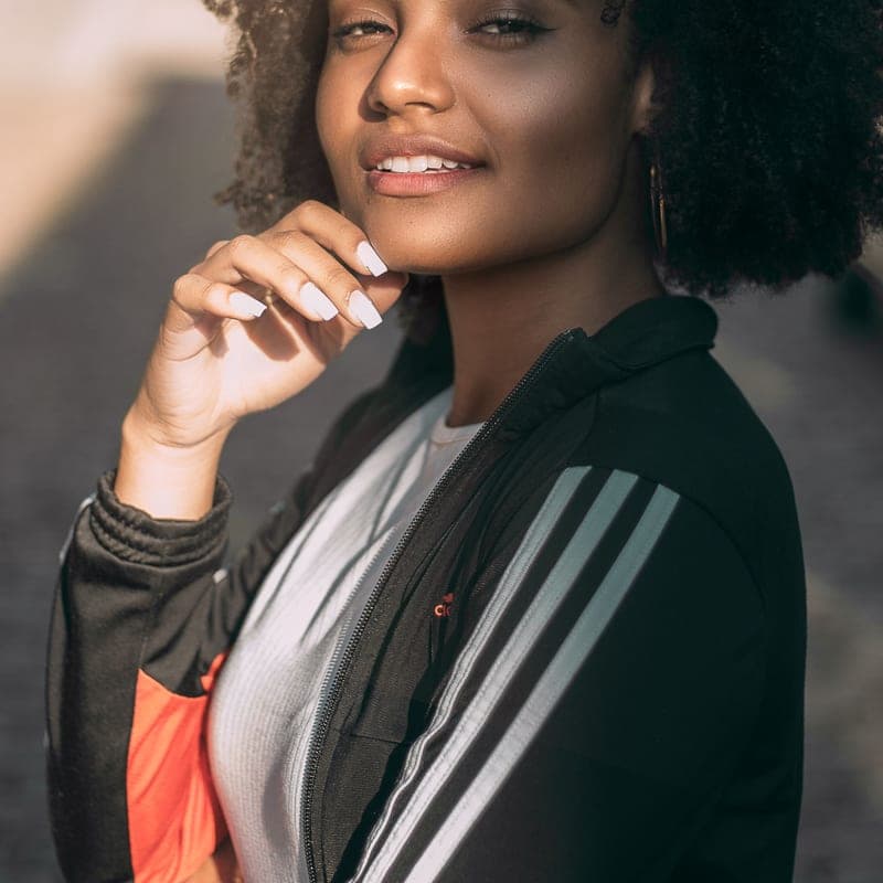 Portrait of a smiling woman in a dark jacket