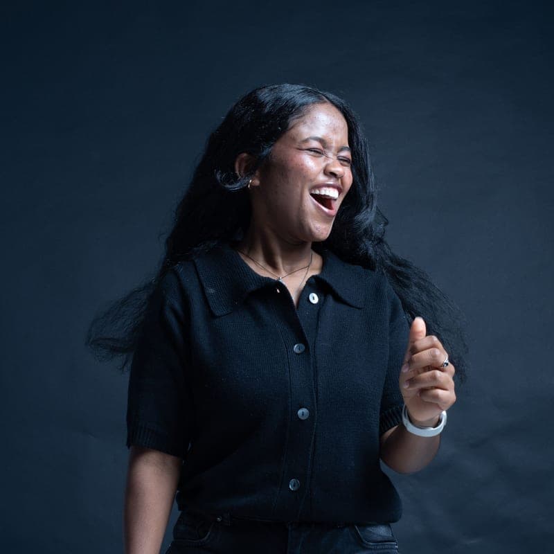 Portrait of a laughing woman in a dark shirt