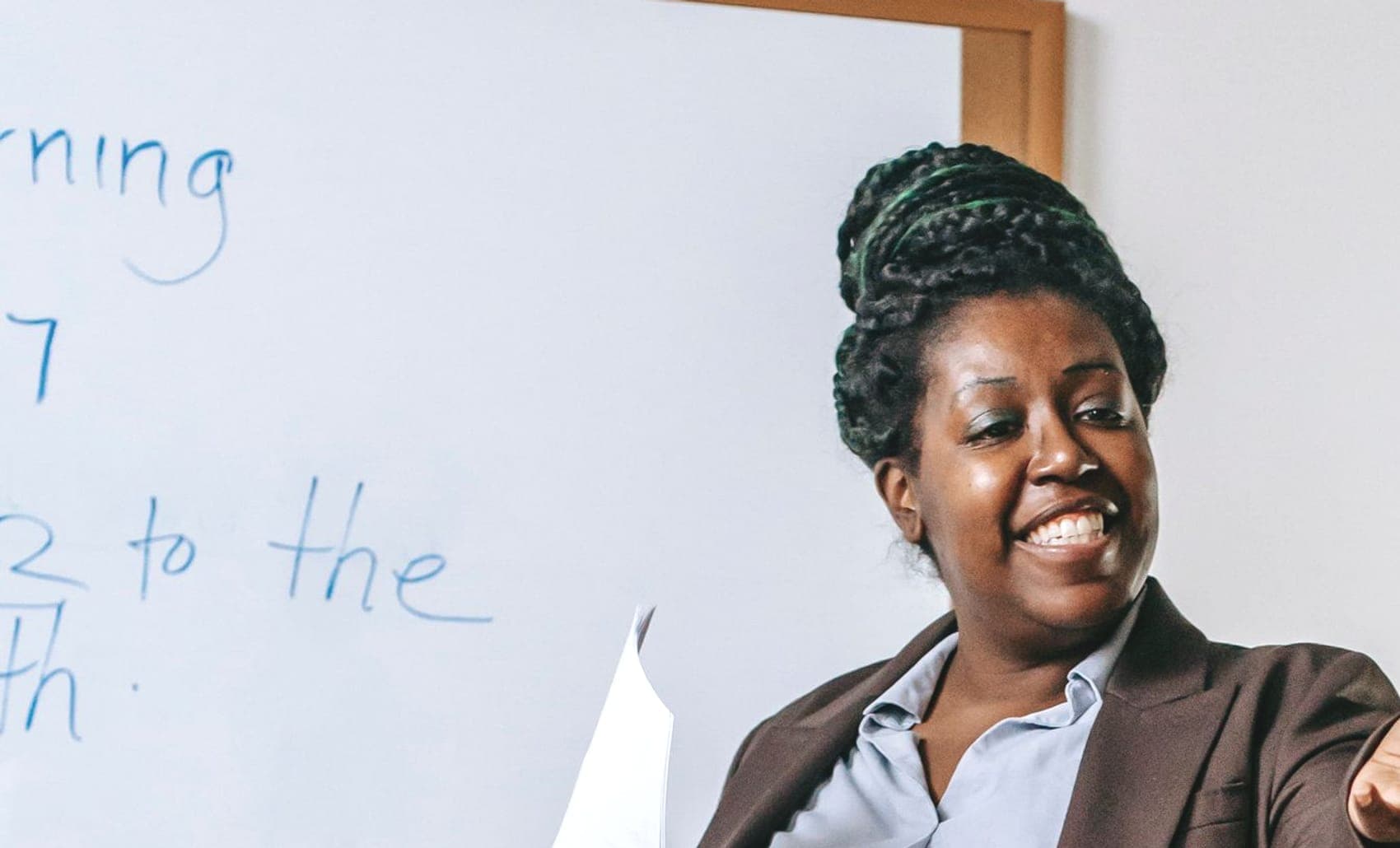 A teacher answering a question from a pupil during a lesson